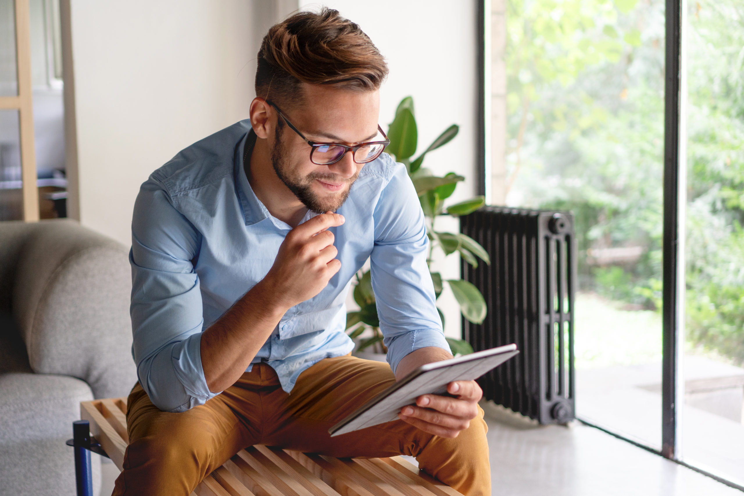 Young Man looking at digital tablet